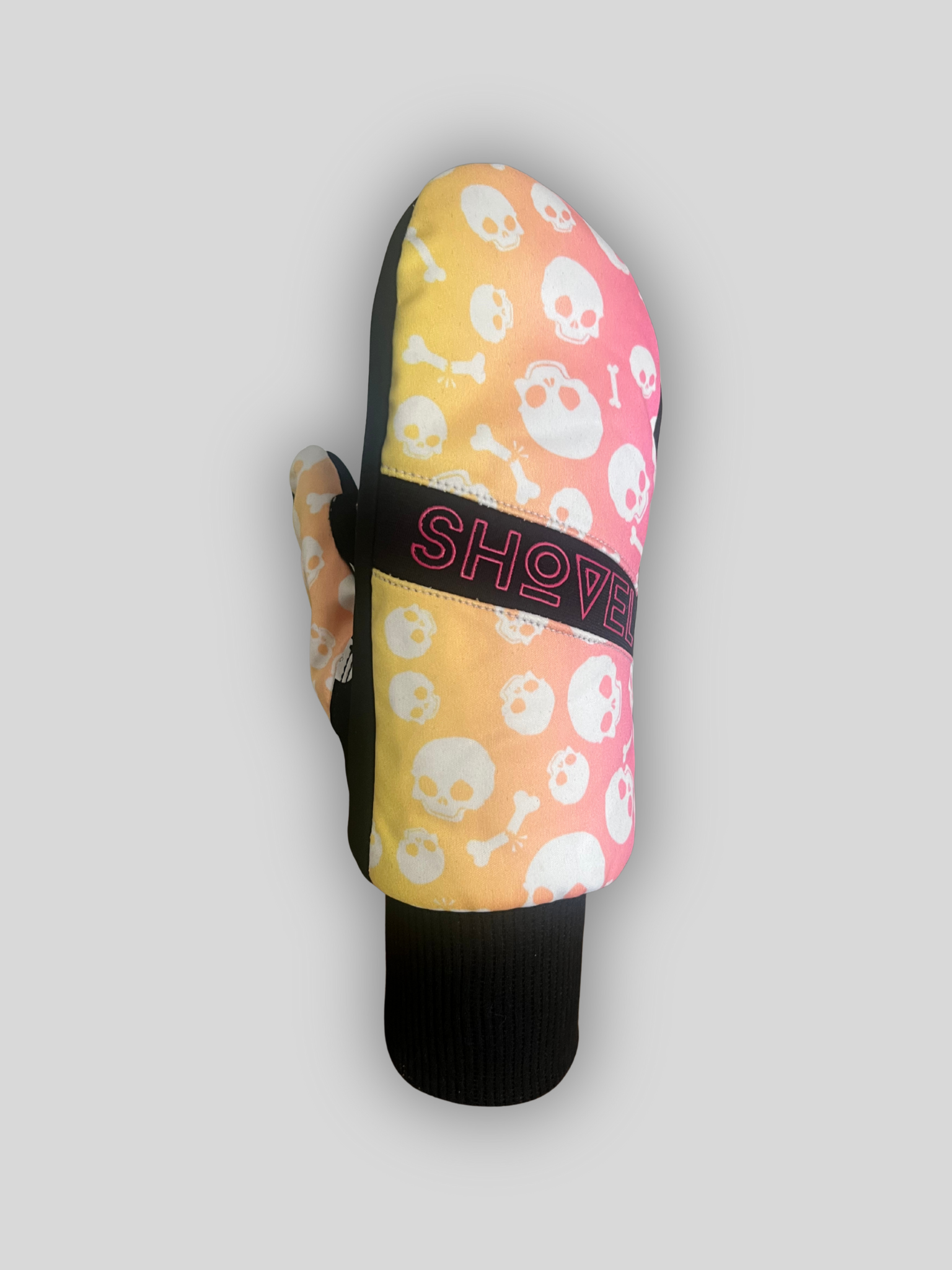 Uk best Shovel Snowsports Skull Mitts –  ski and snowboard gloves with bold skull design on the front and silicone skull grip on the palm, shown on a grey background.