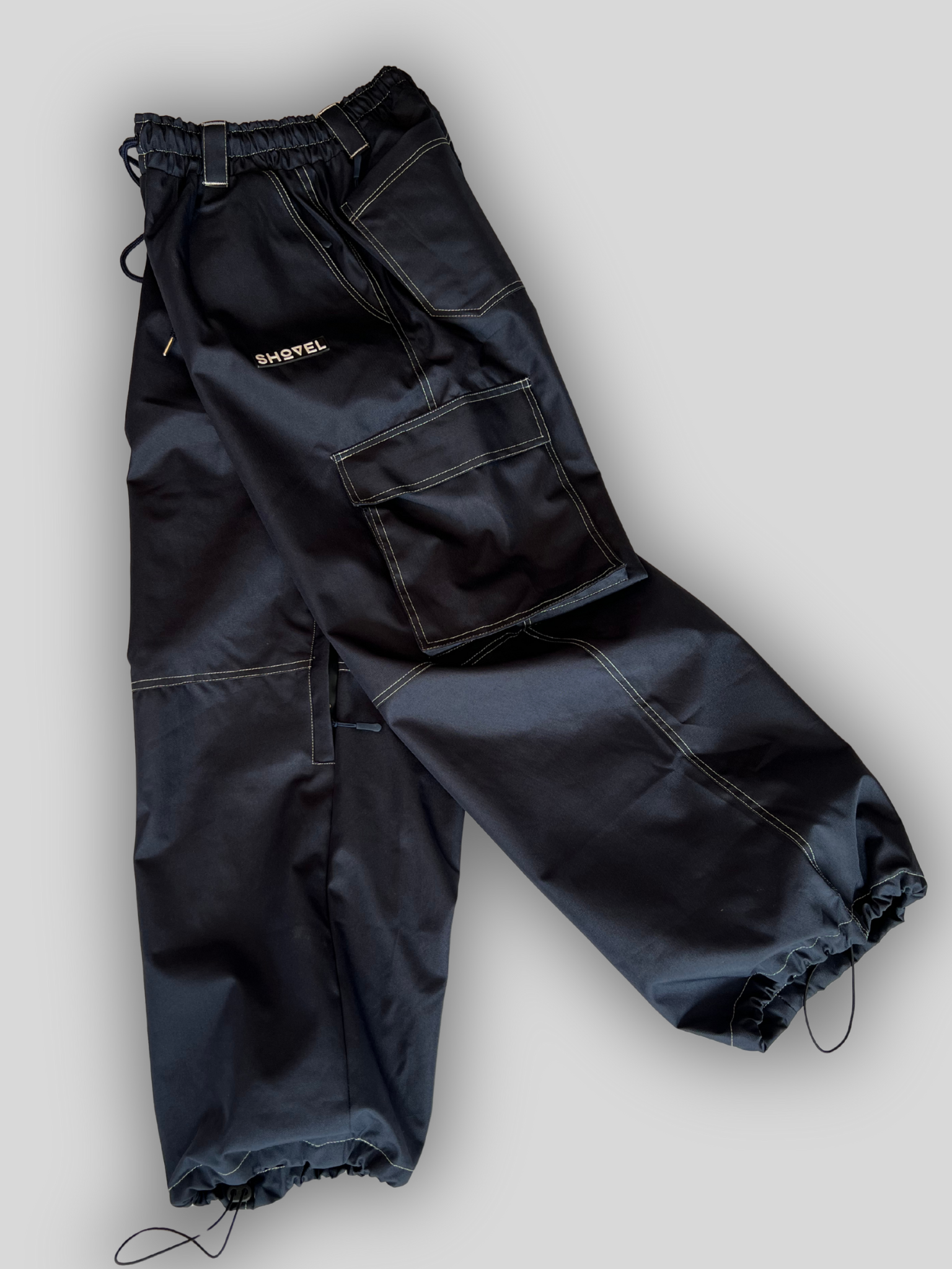 Main photo of blue jeans style skin Snowboard pants with logos and side pockets.