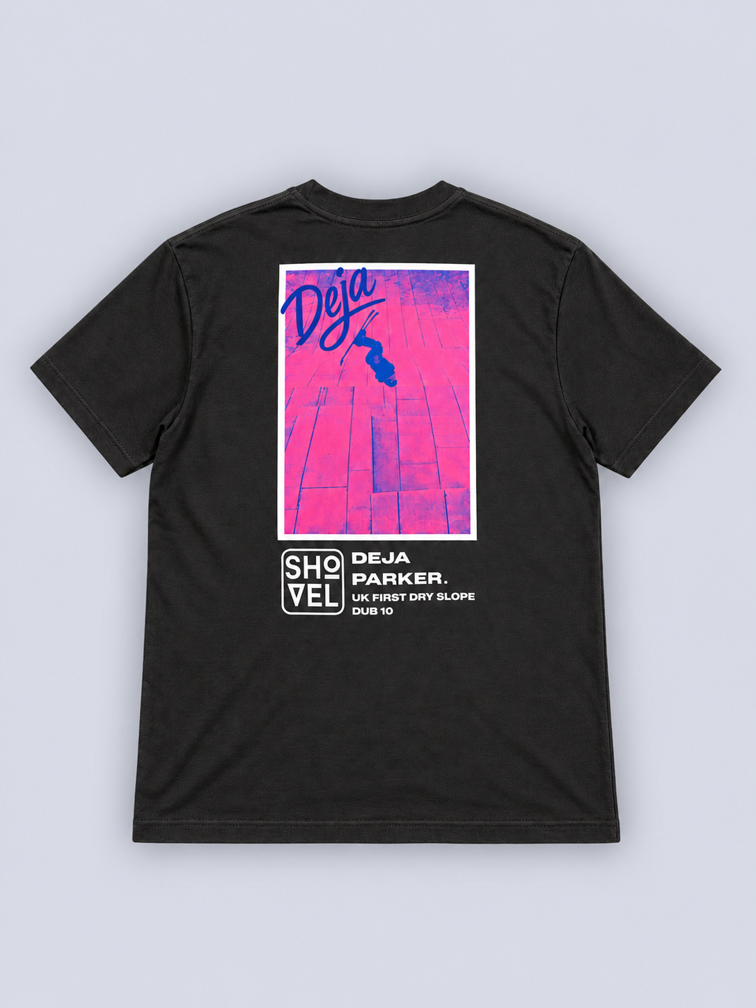 Back view of black DeJa Parker signature Shovel T-shirt on pale grey studio background